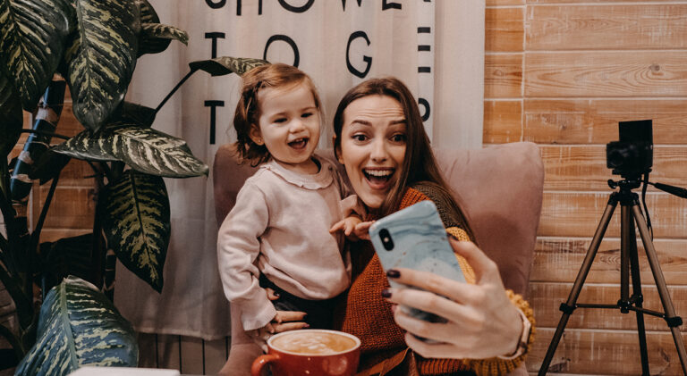 Online jobs for stay-at-home moms. Work From Home women with kids. Blogger girl and her little daughter have fun together